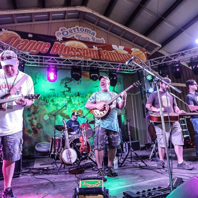 photo of music group on stage. credit Brian Hensley Photography